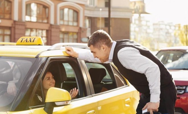 handsome-man-talking-female-taxi-driver-through-opened-window_392895-145501-transformed